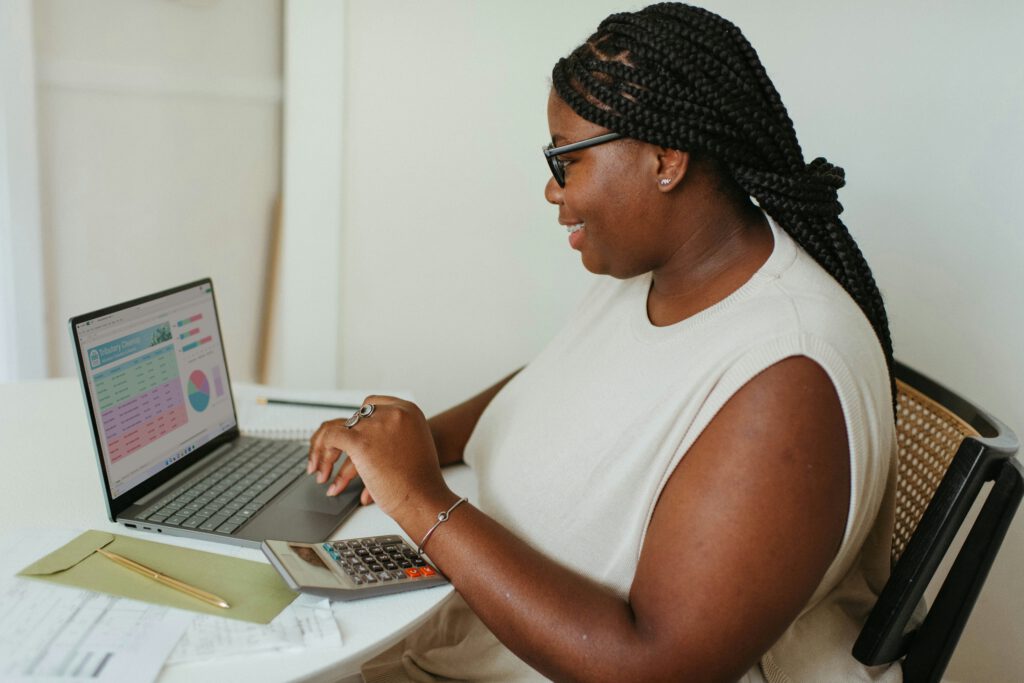 Entrepreneur working on finances in a white room